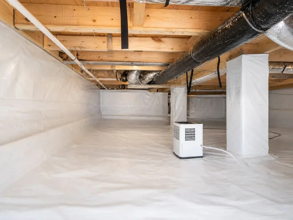 Fully encapsulated crawl space with vapor barrier and dehumidifier